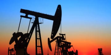 oil rig against red sky