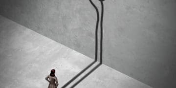 woman contemplating blowing a whistle