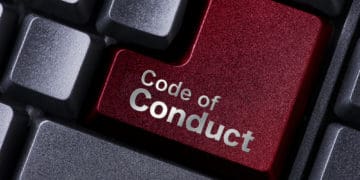 concept of code of conduct expressed in text on a computer keyboard