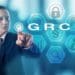 businessman pushing virtual GRC button