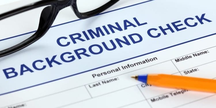 closeup of background check form with glasses