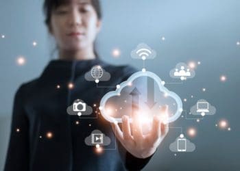 woman holding virtual cloud icon