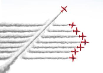 plane flying across other planes' contrails