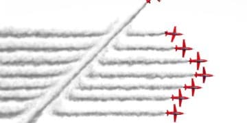 plane flying across other planes' contrails