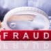 white magnifying glass hovering over fraud in red block letters