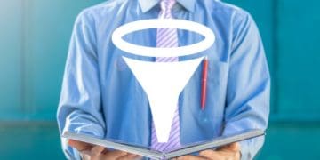 man holding book with funnel icon