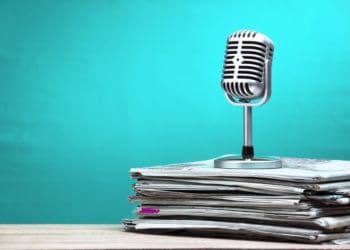 microphone on stack of newspapers