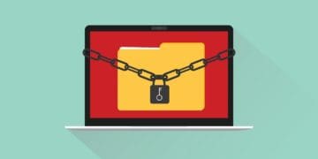 ransomware concept illustration with file folder on laptop secured with chain and padlock