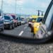 traffic seen through car's side mirror