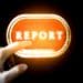 hand pushing glowing report button