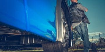 back view of big rig trucker