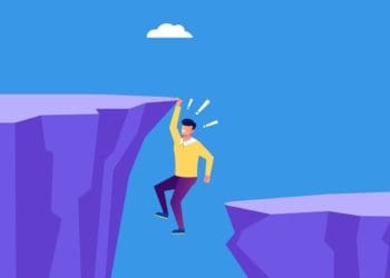 illustration of man hanging from cliff