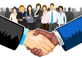 ethnically diverse business team with handshake