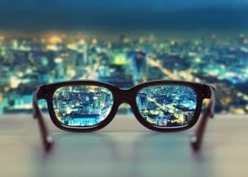 cityscape seen in focus through eyeglasses