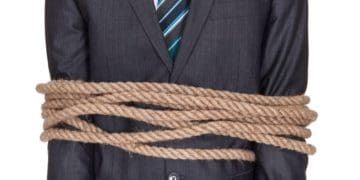 businessman bound with rope