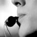 black and white image of man blowing a whistle