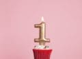 gold 1 candle on cupcake