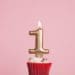 gold 1 candle on cupcake