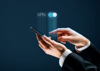 businessman toggling VPN option on smartphone