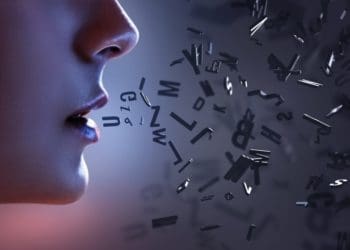 woman in profile speaking jumbled letters