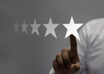 hand selecting 5 stars on virtual screen