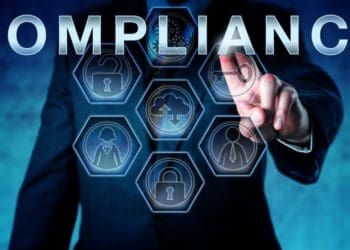 man in suit pressing compliance on virtual screen
