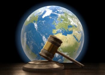 judge's gavel with earth in the background