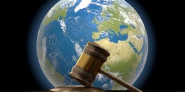 judge's gavel with earth in the background