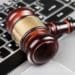 judge's gavel on keyboard