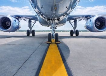 underside of plane on tarmac