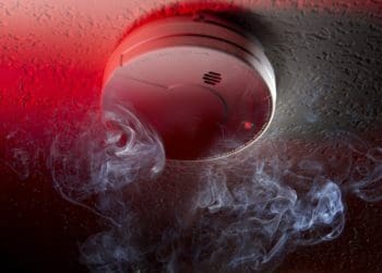 closeup of ceiling mounted smoke detector