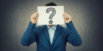 businessman with question mark over his face