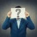 businessman with question mark over his face