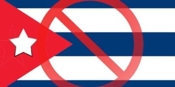 red prohibiting sign over cuban flag
