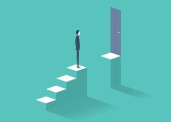 businessman standing at gap in stairs