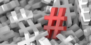 red hashtag on sea of white hashtags
