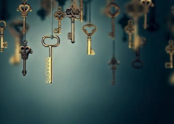 hanging gold keys on blue background