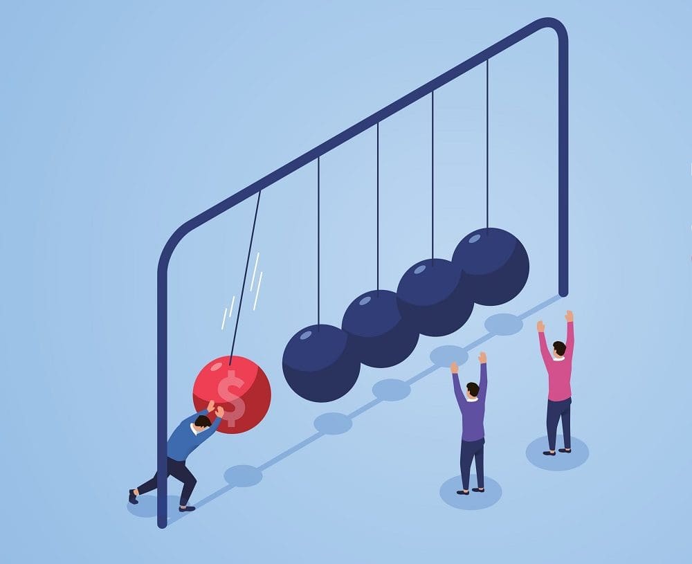 figure putting newton's cradle in motion