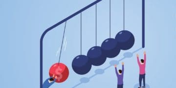 figure putting newton's cradle in motion