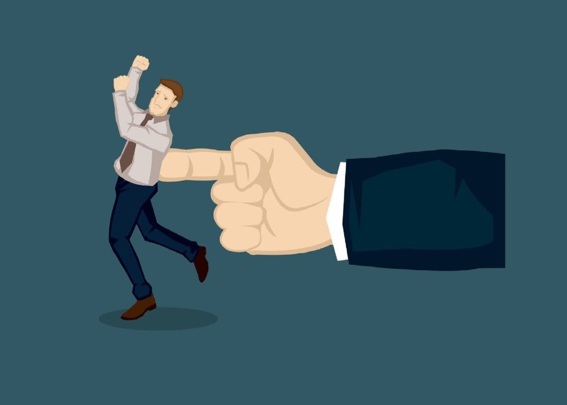 giant hand pushing businessman with one finger