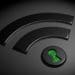 black wifi symbol with green keyhole in the dot