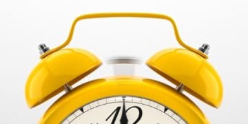 closeup of yellow clock