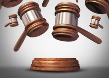 raining gavels on gray background