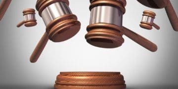 raining gavels on gray background