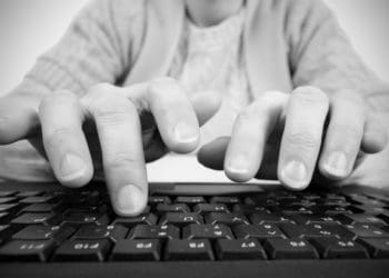 hands hovering over keyboard