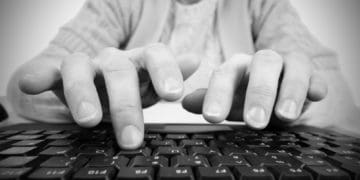 hands hovering over keyboard