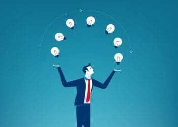 businessman juggling light bulbs