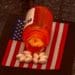 bottle of pills on miniature american flag, opiod crisis