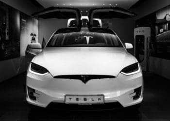 white tesla in showroom