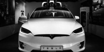 white tesla in showroom